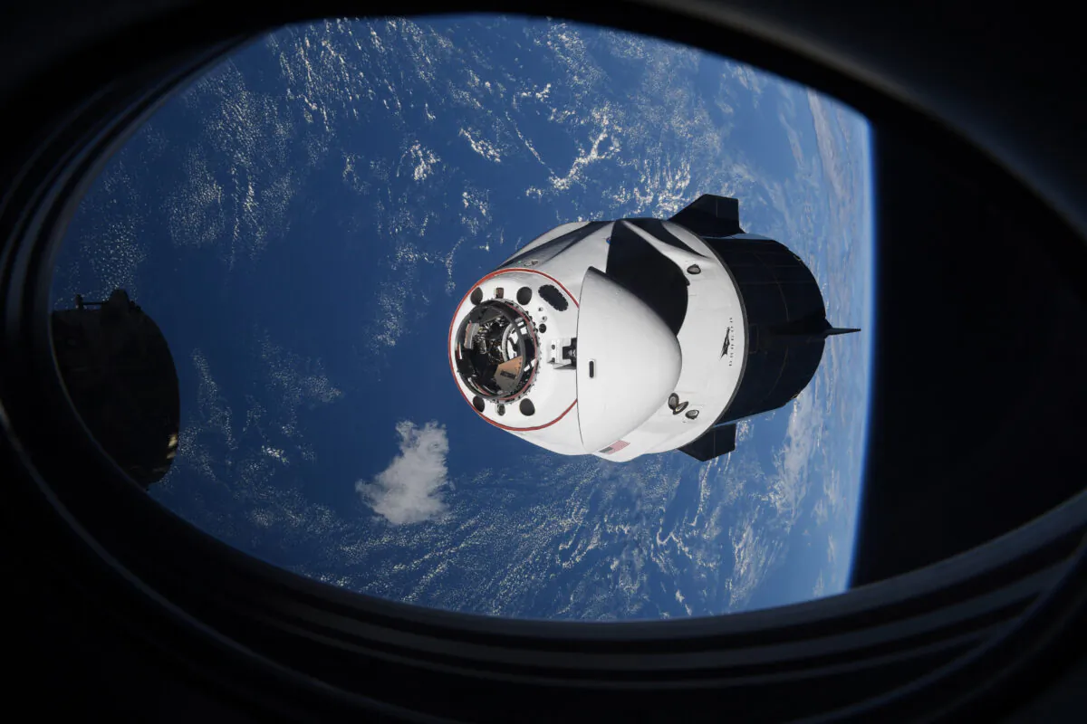 The SpaceX Crew Dragon capsule approaches the International Space Station for docking, on April 24, 2021. (NASA via AP)