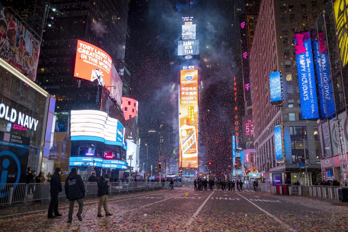 Confetti flies after the Times Square New Year's Eve ball drops in a nearly empty Times Square, in New York, early Jan. 1, 2021. (Craig Ruttle/AP Photo)
