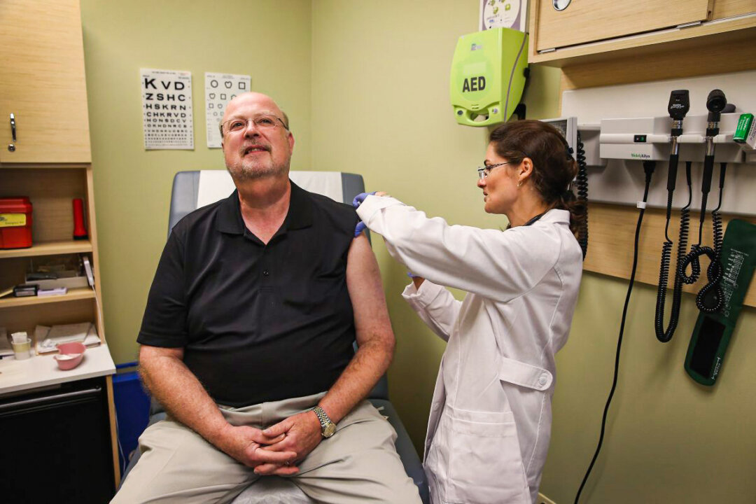 A file photo of a man receiving a flu shot. (Scott Olson/Getty Images)