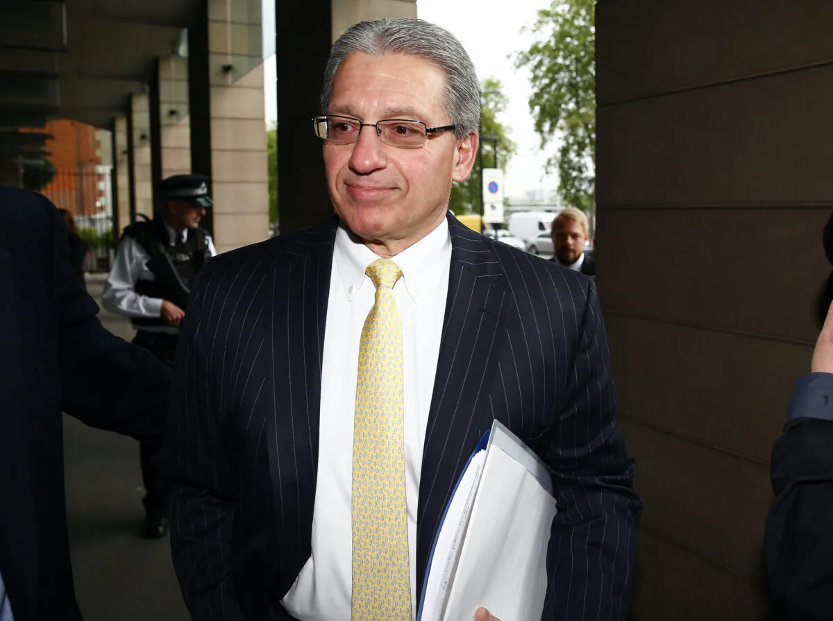 Frank D'Amelio, Executive Vice President, Business Operations and Chief Financial Officer of Pfizer Inc., arrives at Portcullis House to attend a parliamentary business and enterprise committee hearing on the future of AstraZeneca, in central London, on May 13, 2014. (Andrew Winning/Reuters)