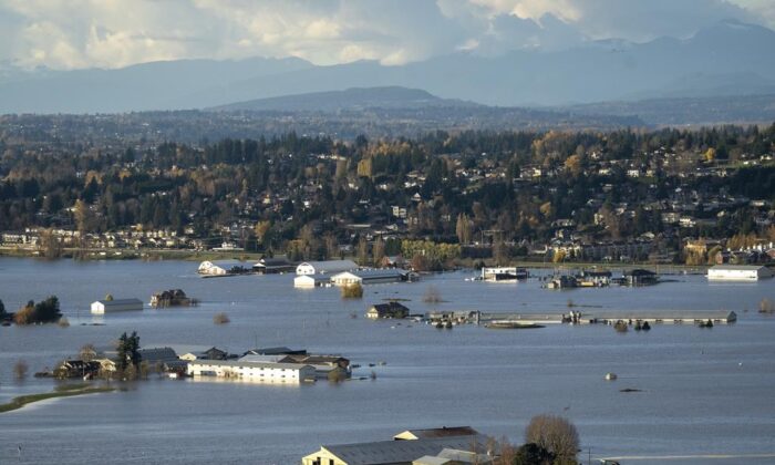 Properties inundated by flood waters are seen in Abbotsford, B.C., Nov. 16, 2021. ( Canadian Press/Jonathan Hayward)