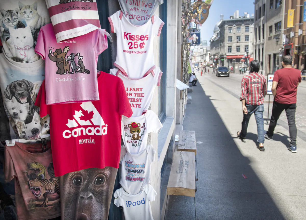 People walk by a souvenir store in Old Montreal, May 24, 2021. In North America, Quebec bests only the Atlantic provinces and Mexican states in economic freedom, according to a report by the Fraser Institute. (The Canadian Press/Graham Hughes)