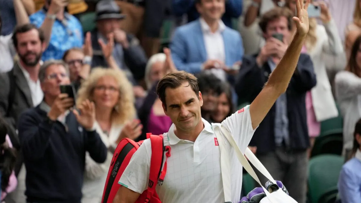 Switzerland's Roger Federer leaves the court on day nine of the Wimbledon Tennis Championships in London, on July 7, 2021. (Alberto Pezzali/AP Photo)