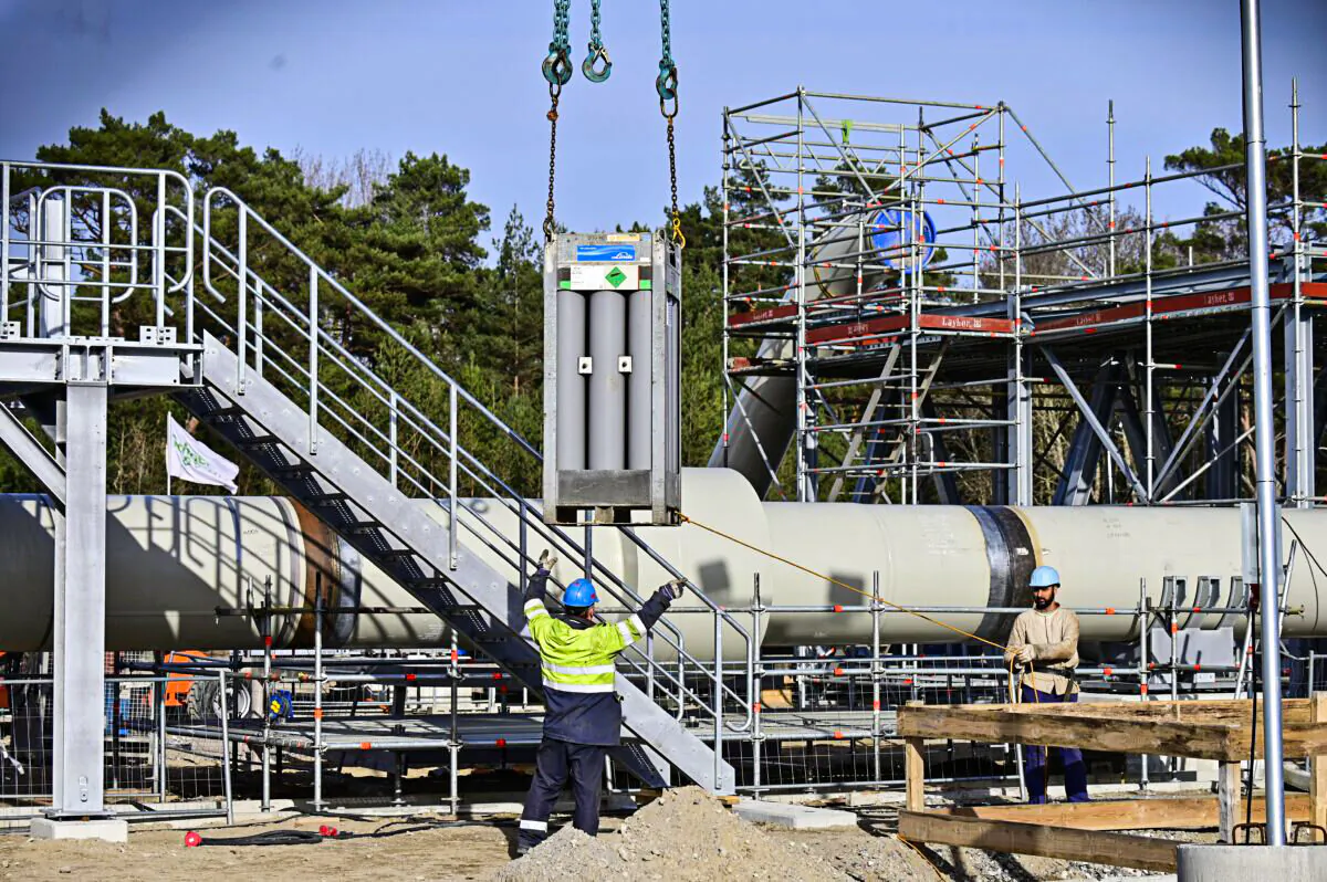 Men work at the construction site of the Nord Stream 2 gas pipeline in Lubmin, northeastern Germany, on March 26, 2019. (Tobias Schwarz/AFP via Getty Images)