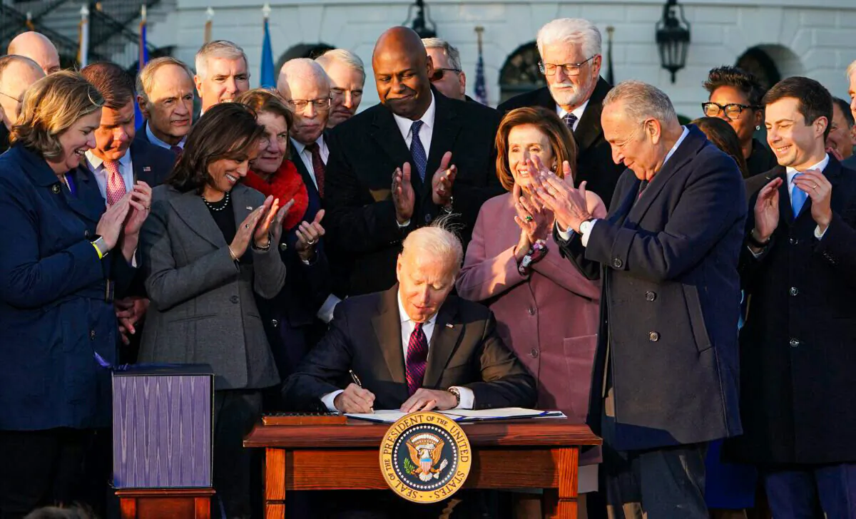 U.S. President Joe Biden takes part in a signing ceremony for H.R. 3684, the Infrastructure Investment and Jobs Act on the South Lawn of the White House in Washington, D.C., on Nov. 15, 2021. (Mandel Ngan/AFP via Getty Images)