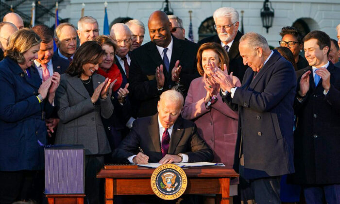 U.S. President Joe Biden takes part in a signing ceremony for H.R. 3684, the Infrastructure Investment and Jobs Act on the South Lawn of the White House in Washington, D.C., on Nov. 15, 2021. (Mandel Ngan/AFP via Getty Images)