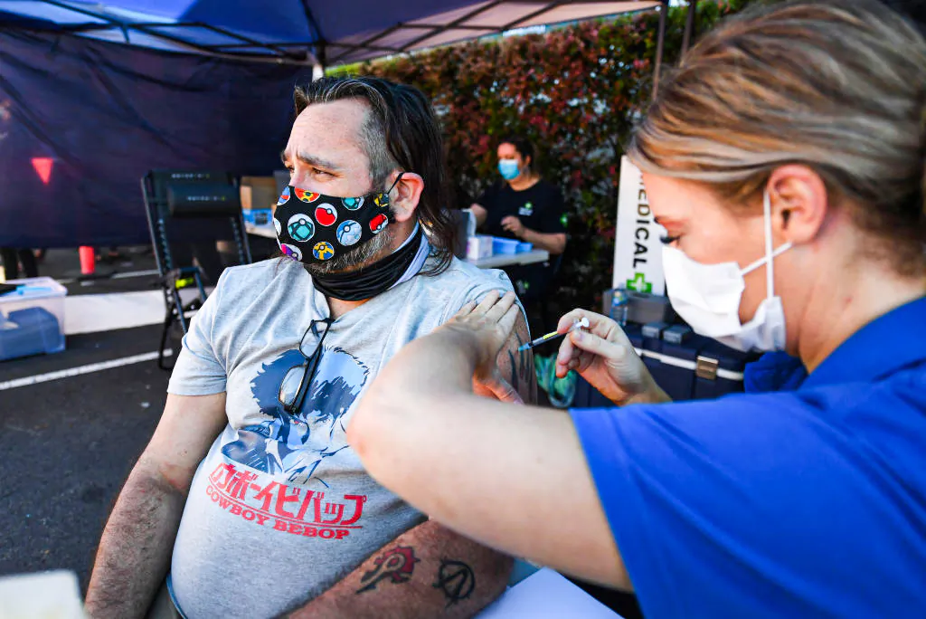 BRISBANE, AUSTRALIA - OCTOBER 16: Shaun Fenwick receives the Covid-19 vaccine outside a Bunnings hardware store on October 16, 2021 in Brisbane, Australia. The Queensland state government is hosting pop-up vaccination clinics at Bunnings stores around the state this weekend to increase access to the COVID-19 vaccine. (Photo by Dan Peled/Getty Images)