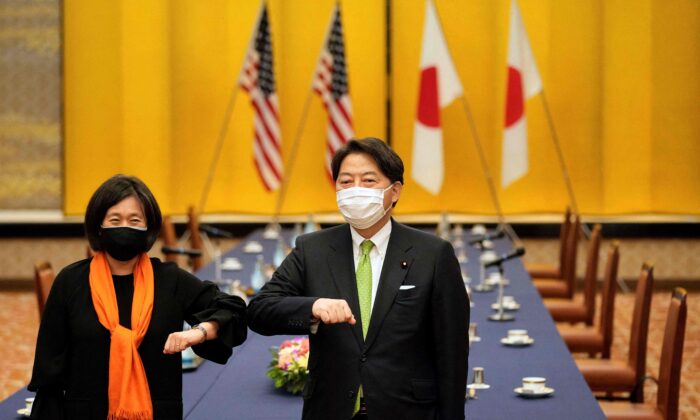 US Trade Representative Katherine Tai (L) elbow bumps with Japan's Foreign Minister Yoshimasa Hayashi (R) ahead of their meeting at the Iikura Guest House in Tokyo, on Nov. 17, 2021. (Franck Robichon/POOL/AFP via Getty Images)