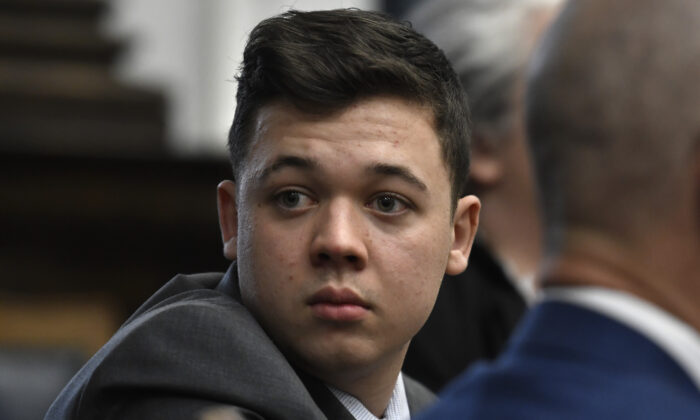 Kyle Rittenhouse looks back as attorneys discuss items in the motion for mistrial presented by his defense during his trial at the Kenosha County Courthouse in Kenosha, Wis., on Nov. 17, 2021. (Sean Krajacic/Pool via Getty Images)