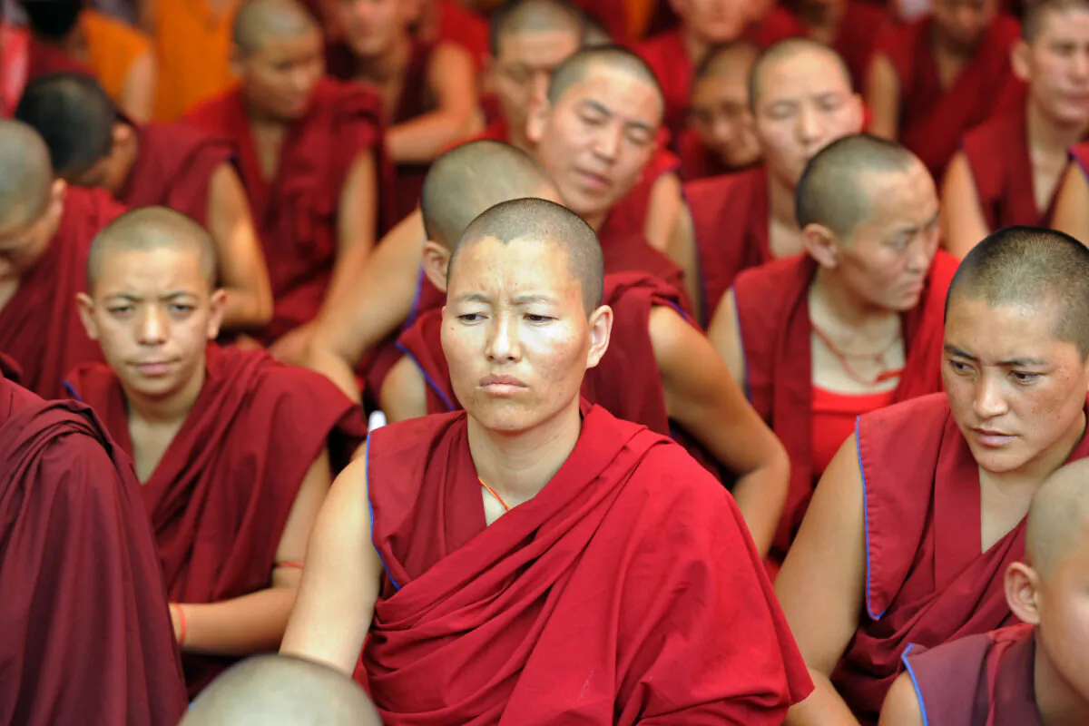 Tibetan Buddhist monks and nuns participate in a sit-in solidarity rally against communist China's rule on Tibet, in New Delhi, on Oct. 18, 2011. (Raveendran/AFP via Getty Images)