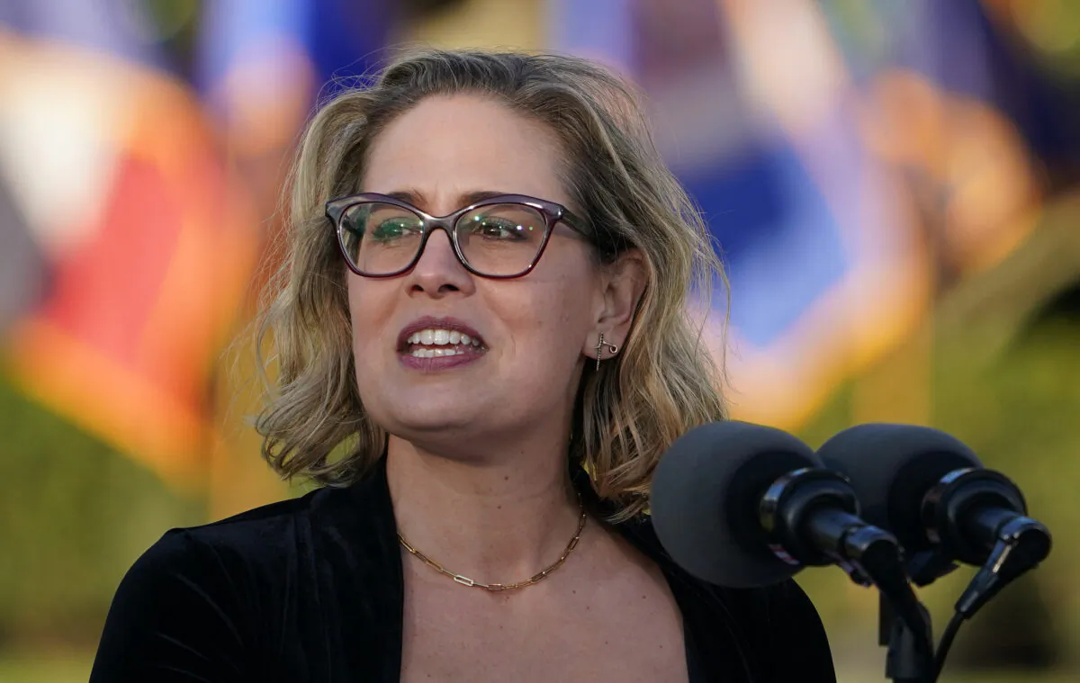 Sen. Kyrsten Sinema (D-Ariz.) speaks during a signing ceremony for H.R. 3684, the Infrastructure Investment and Jobs Act, on the South Lawn of the White House in Washington on Nov. 15, 2021. (Mandel Ngan/AFP via Getty Images)
