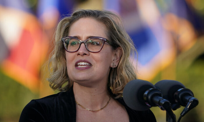 Sen. Kyrsten Sinema (D-Ariz.) speaks during a signing ceremony for H.R. 3684, the Infrastructure Investment and Jobs Act on the South Lawn of the White House in Washington on Nov. 15, 2021. (Mandel Ngan/AFP via Getty Images)