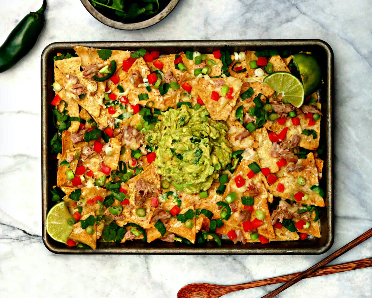 This family-style nacho platter makes use of little bits of dark meat salvaged from the turkey, combined with cheese, peppers, and tons of mashed avocados. (Lynda Balslev for Tastefood)