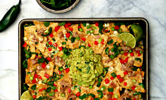 This family-style nacho platter makes use of little bits of dark meat salvaged from the turkey, combined with cheese, peppers, and tons of mashed avocados. (Lynda Balslev for Tastefood)
