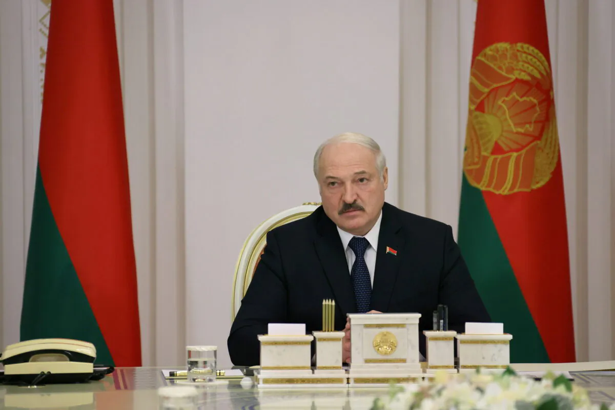 Belarusian President Alexander Lukashenko chairs a meeting, dedicated to the migrant crisis on the Belarusian–Polish border, in Minsk, Belarus, on Nov. 16, 2021. (Nikolai Petrov/BelTA/Handout via Reuters)