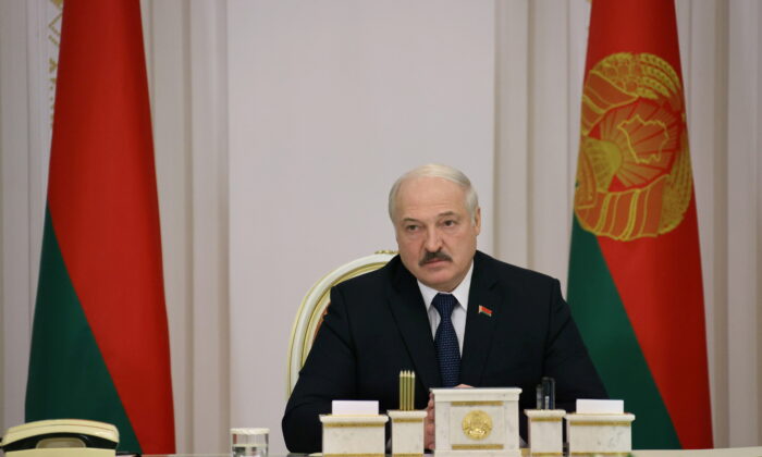 Belarusian President Alexander Lukashenko chairs a meeting, dedicated to the migrant crisis on the Belarusian–Polish border, in Minsk, Belarus, on Nov. 16, 2021. (Nikolai Petrov/BelTA/Handout via Reuters)