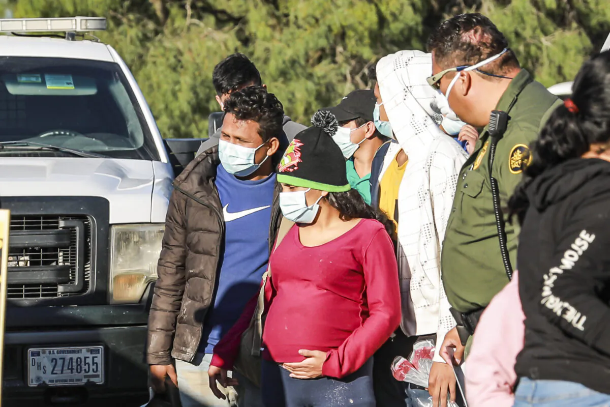 Border Patrol agents apprehend and transport illegal immigrants who have just crossed the river into La Joya, Texas, on Nov. 17, 2021. (Charlotte Cuthbertson/The Epoch Times)