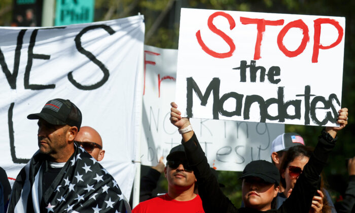 Protestors gather in Grand Park outside City Hall at a March for Freedom rally demonstrating against the L.A. City Council’s COVID-19 vaccine mandate for city employees and contractors in Los Angeles, Calif., on Nov. 8, 2021. (Mario Tama/Getty Images)