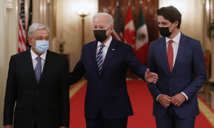 (L-R) U.S. President Joe Biden, Canadian Prime Minister Justin Trudeau, and Mexican President Andres Manuel Lopez Obrador enter the East Room for a North American Leaders’ Summit at the White House in Washington on Nov. 18, 2021. (Alex Wong/Getty Images)