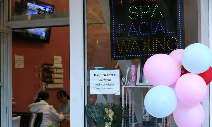 A help wanted sign hangs on the window of a nail salon in San Francisco on Dec. 7, 2012. (Justin Sullivan/Getty Images)
