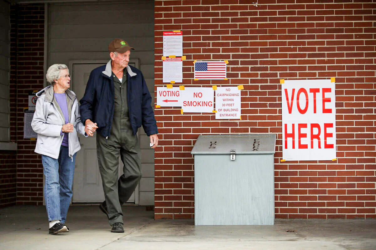 Voters exit after casting their ballots at a polling station setup in the fire department in a file photo. (Joe Raedle/Getty Images)