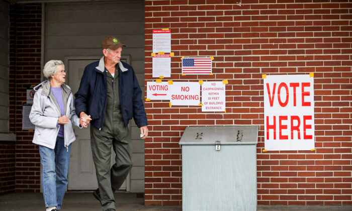 Voters exit after casting their ballots at a polling station setup in the fire department in a file photo. (Joe Raedle/Getty Images)