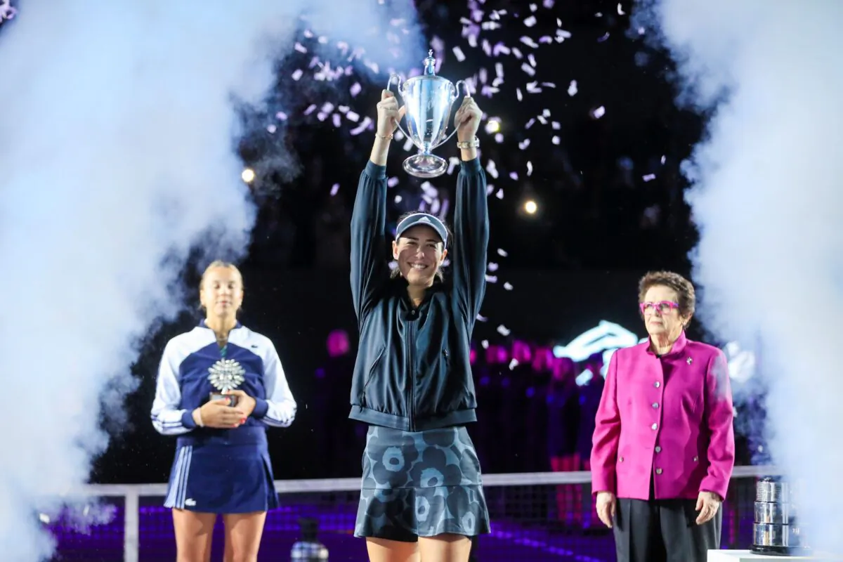 Garbiñe Muguruza, of Spain, holds the trophy during an awarding ceremony after defeating Anett Kontaveit, of Estonia, at the final match of the WTA Finals tennis tournament in Guadalajara, Mexico, on Nov. 17, 2021. (Refugio Ruiz/AP Photo)