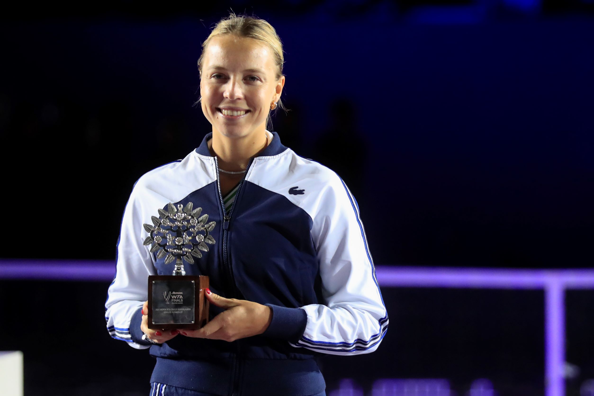 Anett Kontaveit, of Estonia, poses with her trophy