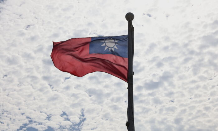 A Taiwanese flag flaps in the wind in Taoyuan, Taiwan, on June 30, 2021. (Ann Wang/Reuters)