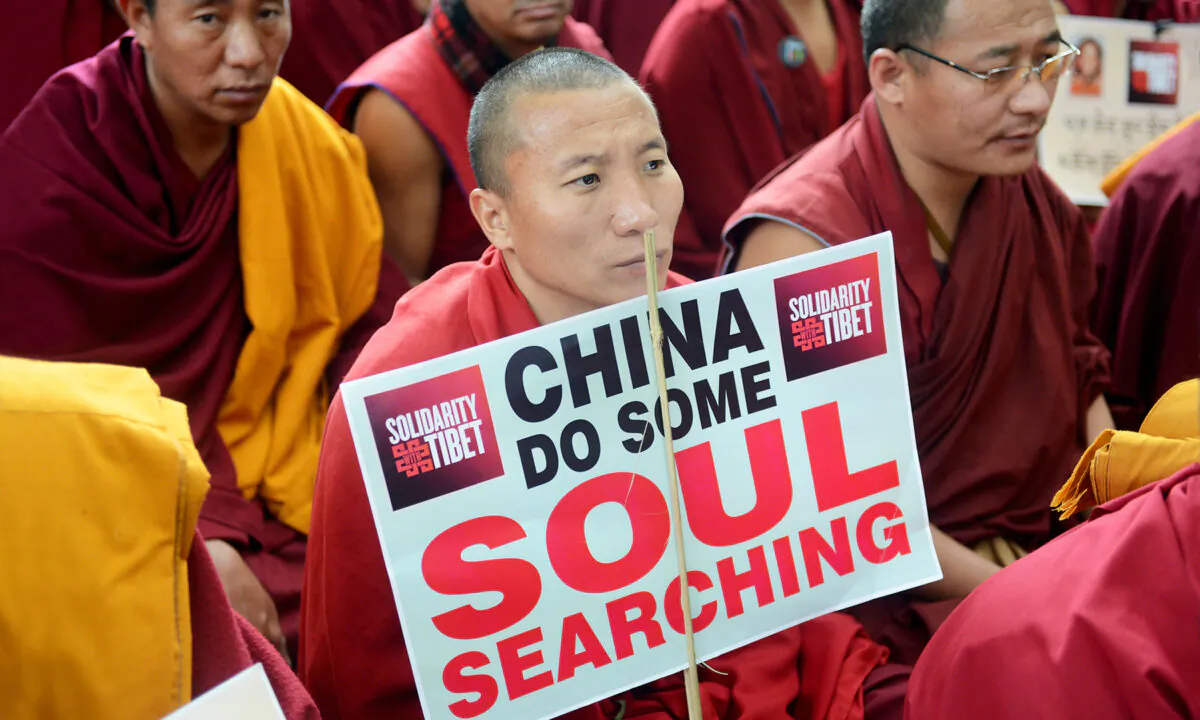 Tibetan Buddhist monks and nuns attend a sit-in solidarity rally against the Chinese Communist Party’s rule on Tibet, in the Indian capital city of New Delhi on Feb. 2, 2013. ﻿(Raveendran/AFP via Getty Images)