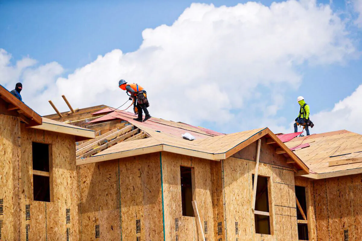 Carpenters work on building new townhomes that are still under construction, while building material supplies are in high demand, in Tampa, Fla., on May 5, 2021. (Octavio Jones/Reuters)