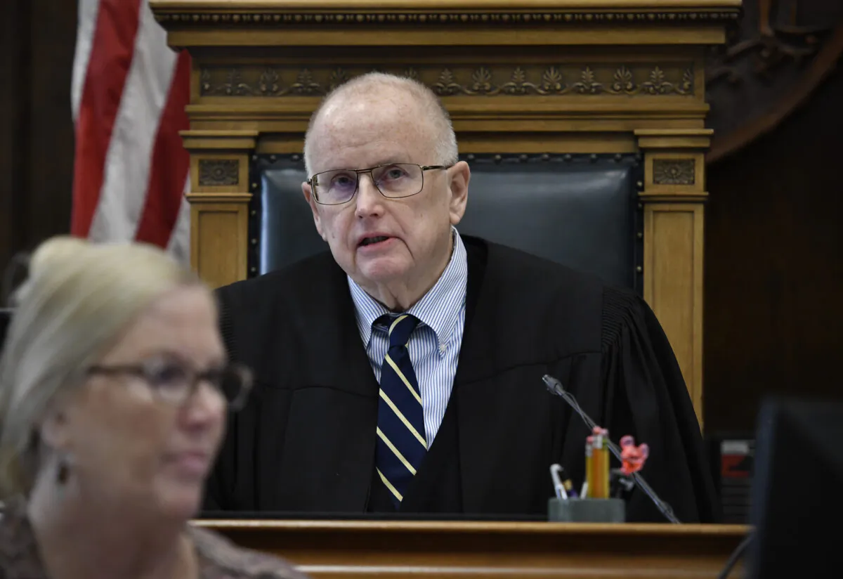 Judge Bruce Schroeder alerts the attorneys that a man claiming to be with a major news network was arrested the previous night during Kyle Rittenhouse's trial at the Kenosha County Courthouse in Kenosha, Wis., on Nov. 18, 2021. (Sean Krajacic/The Kenosha News via AP, Pool)