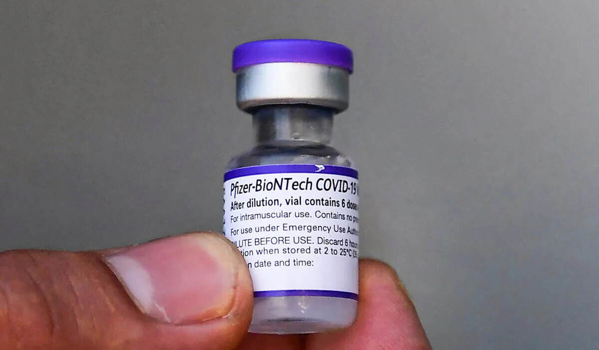 A 5-dose vial of the Pfizer COVID-19 vaccine is held in Los Angeles, Calif., on Sept. 21, 2021. (Frederic J. Brown/AFP via Getty Images)
