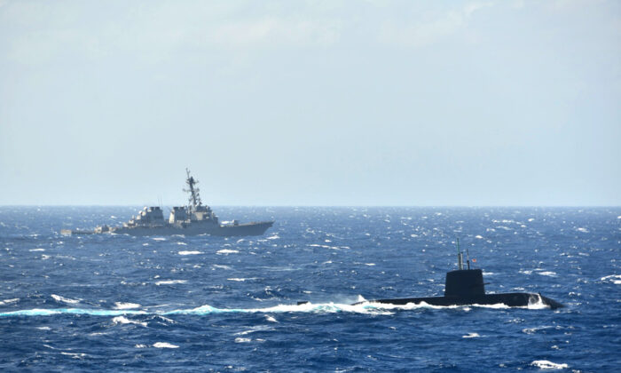Japan’s Maritime Self-Defense Force submarine and a U.S. Navy destroyer pictured in their first joint anti-submarine drill in the South China Sea, on Nov. 16, 2021. (The Japanese Maritime Self-Defense Force)