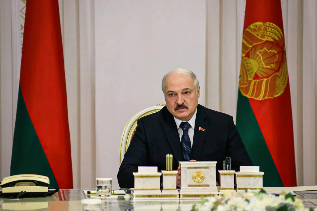 Belarusian President Alexander Lukashenko chairs a meeting, dedicated to the migrant crisis on the Belarusian-Polish border, in Minsk, Belarus November 16, 2021. (Nikolai Petrov/BelTA/Handout via Reuters)