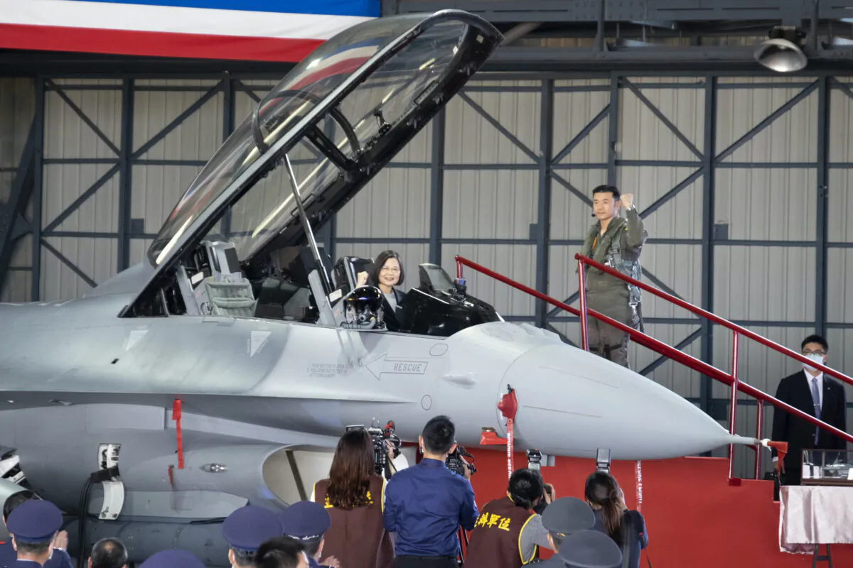 Taiwan's President Tsai Ing-wen poses for photos during a ceremony to commission into service 64 upgraded F-16V fighter jets at an airforce base in Chiayi in southwestern Taiwan on Nov. 18, 2021. (Johnson Lai/AP Photo)