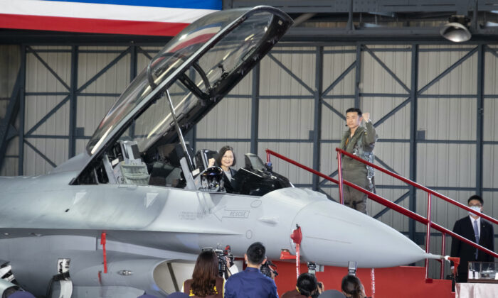 Taiwan's President Tsai Ing-wen poses for photos during a ceremony to commission into service 64 upgraded F-16V fighter jets at an airforce base in Chiayi in southwestern Taiwan on Nov. 18, 2021. (Johnson Lai/AP Photo)