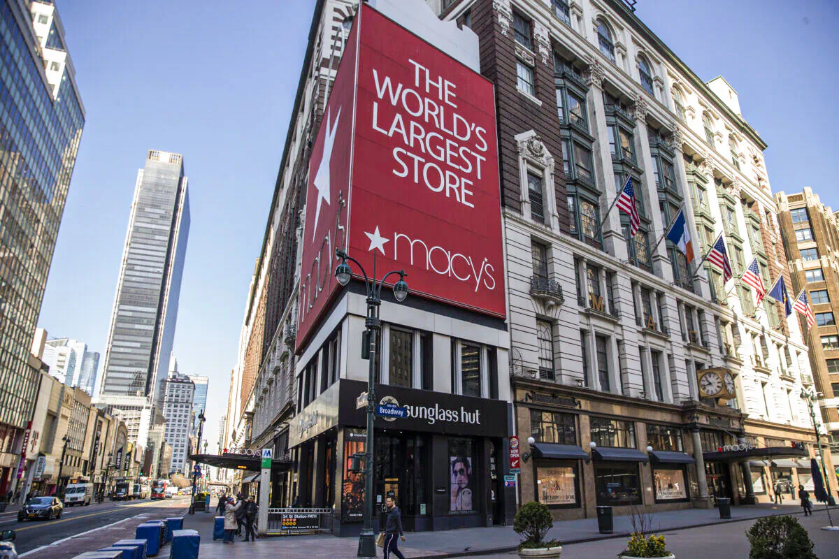 Pedestrians pass by Macy's Department store at Herald Square in New York on March 18, 2020. (Victor J. Blue/Getty Images)
