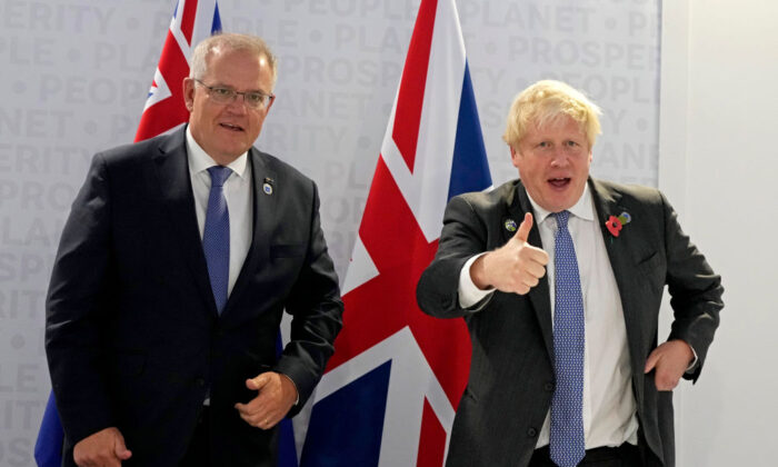 British Prime Minister Boris Johnson (R) and Australia's Prime Minister Scott Morrison gesture prior to a bilateral meeting on the sidelines of the G20 summit in Rome, Italy, on Oct. 30, 2021. (Kirsty Wigglesworth- Pool/Getty Images)