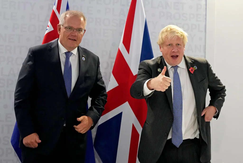 British Prime Minister Boris Johnson (R) and Australia's Prime Minister Scott Morrison gesture prior to a bilateral meeting on the sidelines of the G20 summit in Rome, Italy, on Oct. 30, 2021. (Kirsty Wigglesworth- Pool/Getty Images)