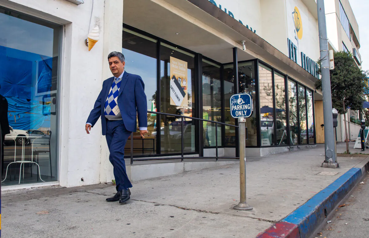 Restaurateur and member of the West Los Angeles Chamber of Commerce Roozbeh Farahanipour walks near his restaurant in Los Angeles on Nov. 18, 2021. (John Fredricks/The Epoch Times)