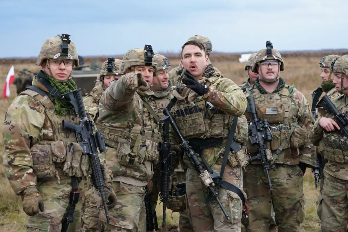Soldiers take part in joint military exercises of units of Poland, Britain, United States, and Romania at the military train ground in Bemowo Piskie, Poland, on Nov. 18, 2021. (Janek Skarzynski/AFP via Getty Images)