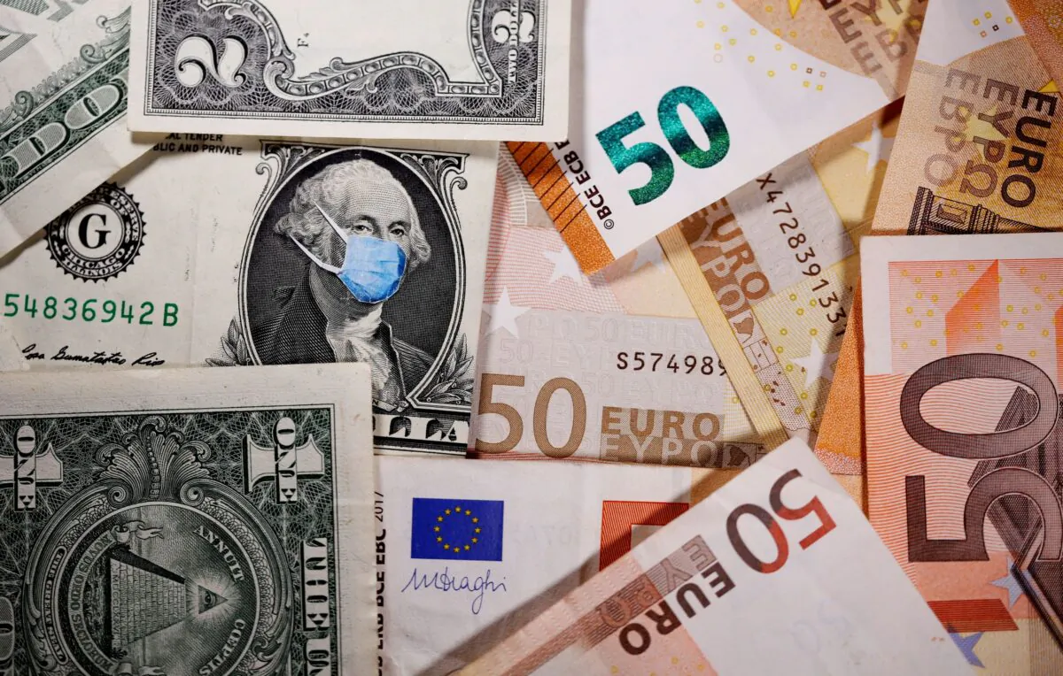 George Washington is seen with printed medical masks on the one Dollar near Euro banknotes in this illustration taken on March 31, 2020. (Dado Ruvic/Illustration/Reuters)
