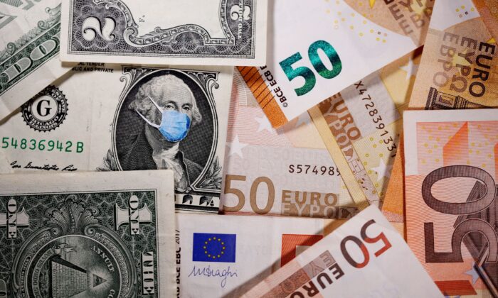 George Washington is seen with printed medical masks on the one Dollar near Euro banknotes in this illustration taken on March 31, 2020. (Dado Ruvic/Illustration/Reuters)