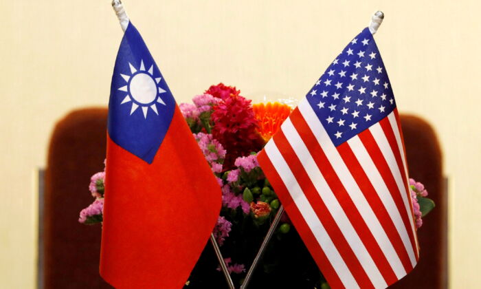 A file photo of the flags of Taiwan and United States are placed for a meeting in Taipei, Taiwan, on March 27, 2018. (Tyrone Siu/Reuters)