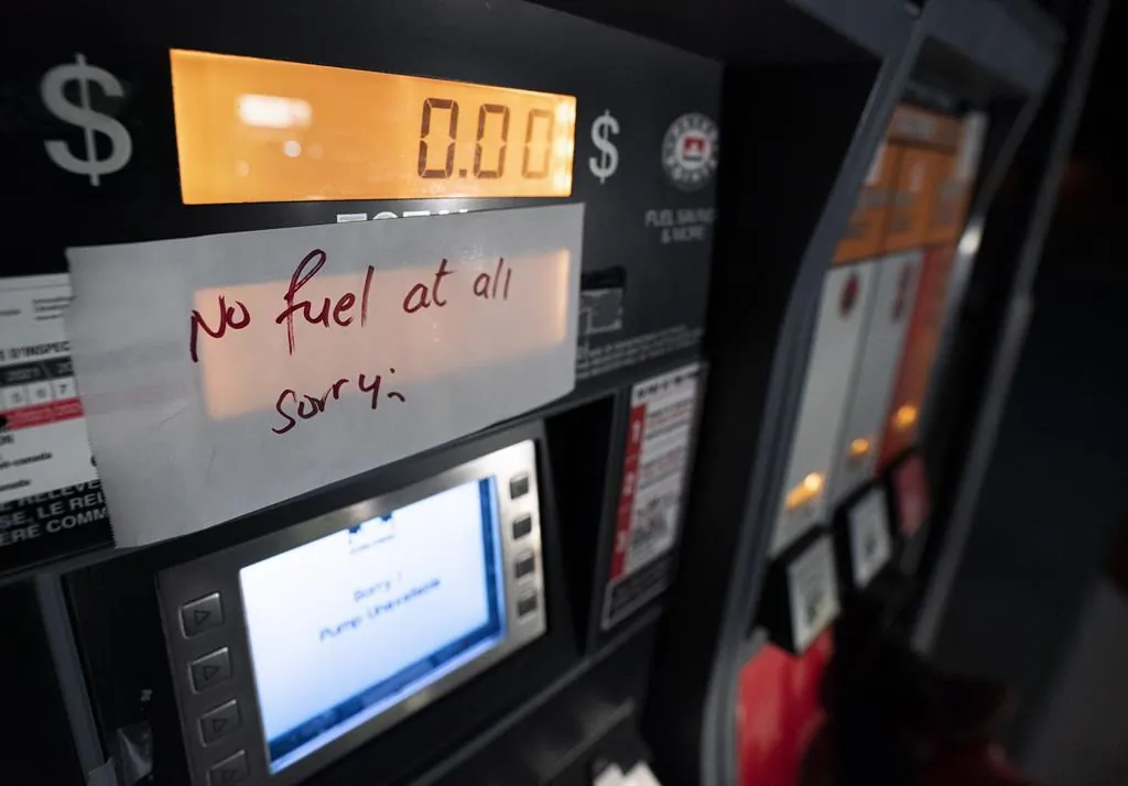 A gas pump with a sign noting no fuel available is pictured at a gas station in Agassiz, B.C., November 17, 2021. (The Canadian Press/Jonathan Hayward)