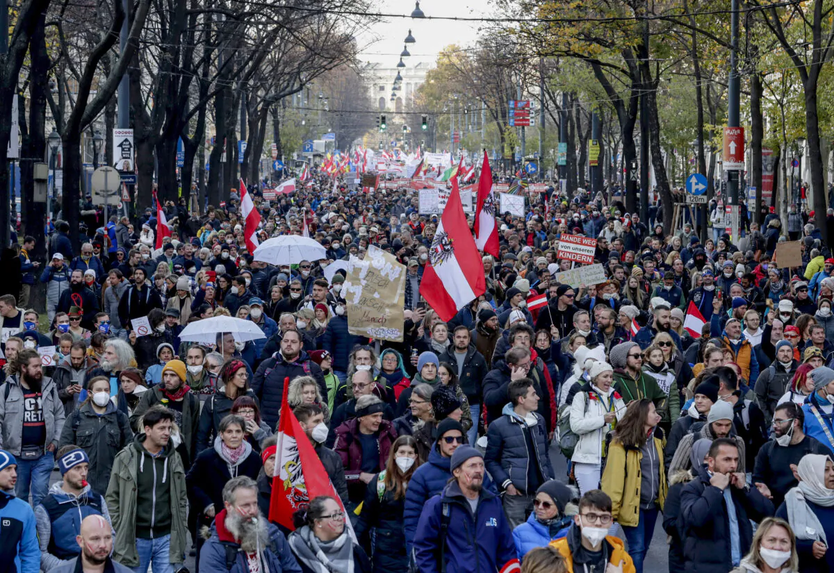 Hundreds of people take part in a demonstration against the country's coronavirus restrictions in Vienna, Austria on Nov. 20, 2021. (Lisa Leutner/AP Photo)