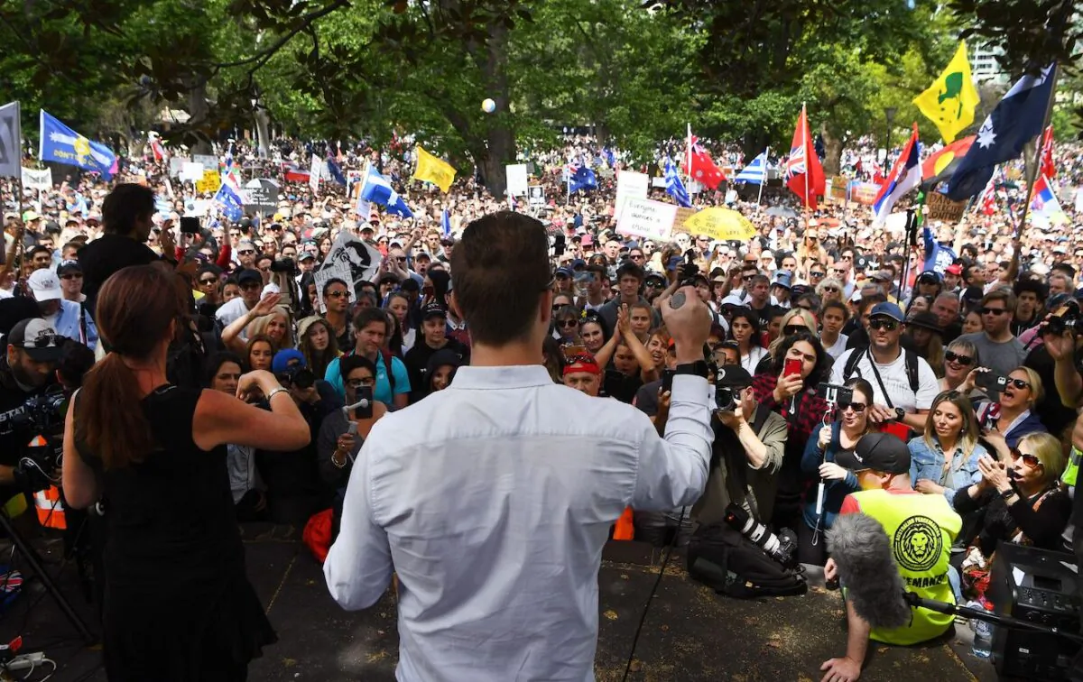 A speaker addresses a rally against Covid-19 lockdown and vaccination measures in Melbourne, Australia, on Nov. 20, 2021. (William West/AFP via Getty Images)