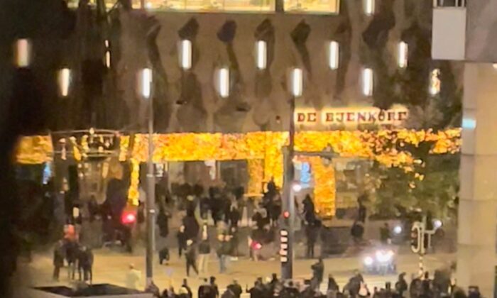 Protesters are seen during demonstrations against coronavirus disease measures which turned violent in Rotterdam, Netherlands on Nov. 19, 2021, in this still image obtained from video provided on social media. (Obtained by Reuters/via Reuters)