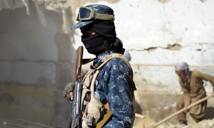 A Taliban member stands guard, in Kandahar, Afghanistan, on Nov. 15, 2021. (Javed Tanveer/AFP via Getty Images)